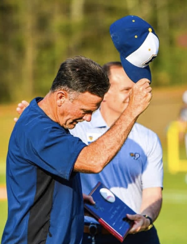 Prince Avenue Christian baseball coach is awarded a plaque to commemorate his 600th coaching victory, a 19-2 win over East Jackson on March 24, 2026. (Charles Jordan Photography, courtesy of Prince Avenue Christian School)