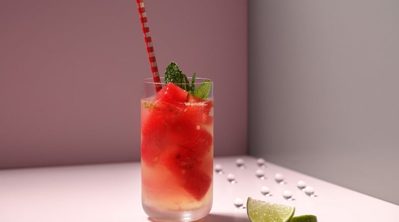 The beauty of watermelon cubes is that they chill your drink without diluting it. Here they give color to a refreshing homemade limeade. (Food styling by Joan Moravek.) (E. Jason Wambsgans/Chicago Tribune/TNS)