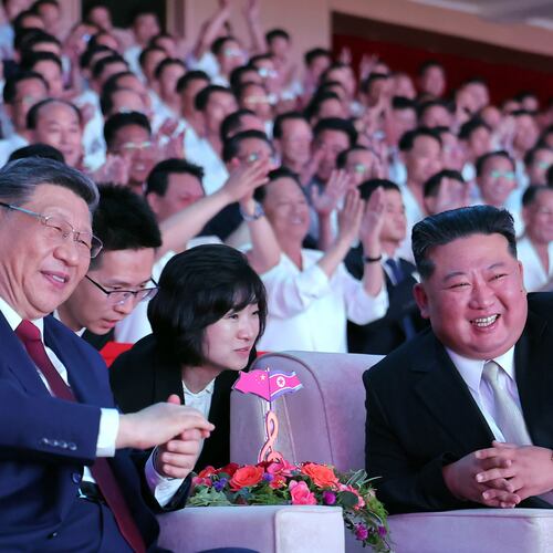 In this photo provided by the North Korean government, North Korean leader Kim Jong Un, right, and Chinese President Xi Jinping, left, smile as they watch welcome performance at Pyongyang Gymnasium in Pyongyang, Monday, June 8, 2026. Independent journalists were not given access to cover the event depicted in this image distributed by the North Korean government. The content of this image is as provided and cannot be independently verified. Korean language watermark on image as provided by source reads: "KCNA" which is the abbreviation for Korean Central News Agency. (Korean Central News Agency/Korea News Service via AP)