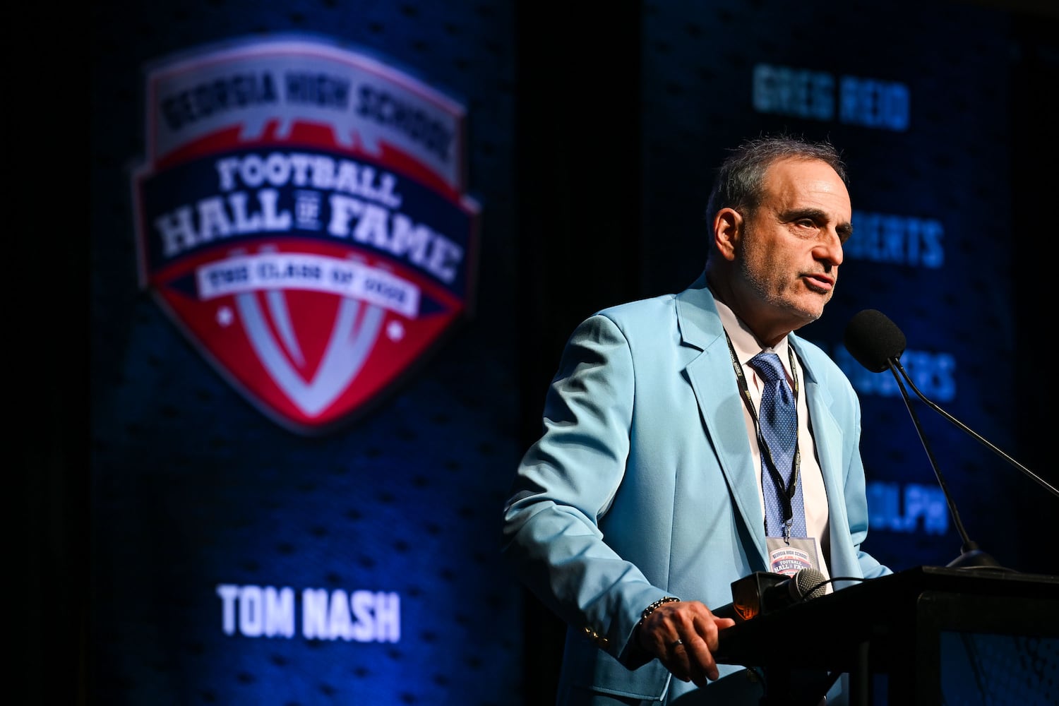 IJ Rosenburg, executive director of the Georgia High School Football Hall greets attendees during an induction ceremony Saturday, Oct. 25, 2025, at the College Football Hall of Fame in Atlanta. (Daniel Varnado for the AJC)