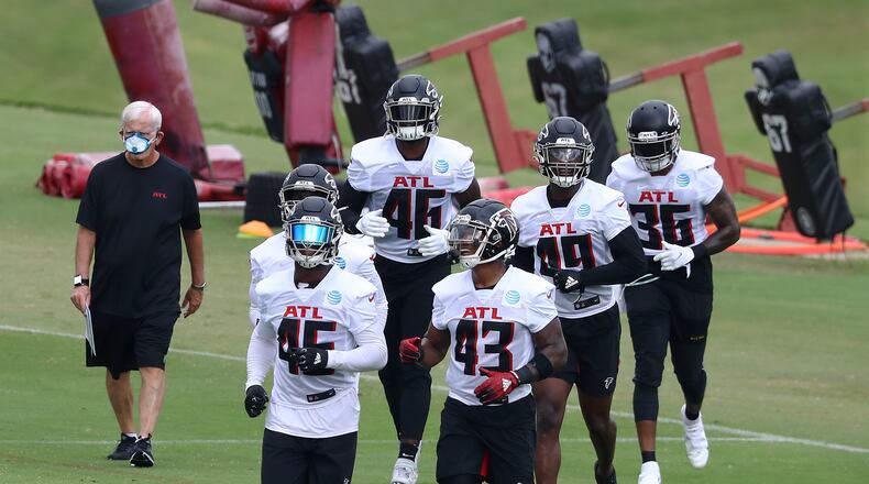 Taking the lead: Rookie Mykal Walker (43) and veteran Deion Jones are out front as the Falcons linebackers make their way to the next set of training camp drills. Curtis Compton ccompton@ajc.com