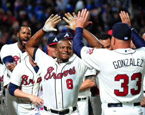 ATLANTA, GA - APRIL 6: Justin Upton #8 of the Atlanta Braves is congratulated by Manager Fredi Gonzalez #33 after his ninth inning game-winning home run against the Chicago Cubs at Turner Field on April 6, 2013 in Atlanta, Georgia. (Photo by Scott Cunningham/Getty Images) Justin Upton has been the Braves' best home-run hitter the past two seasons, but with only one season left on his contract he could be traded this winter.