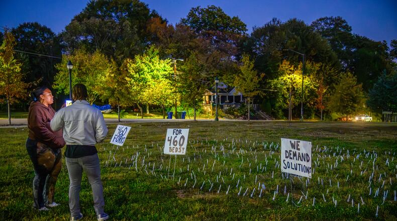Protesters plant 460 forks in the ground outside of the closed Atlanta Medical Center on this, the anniversary of it's closing. November 1, 2023 (Jamie Spaar for the Atlanta Journal Constitution)