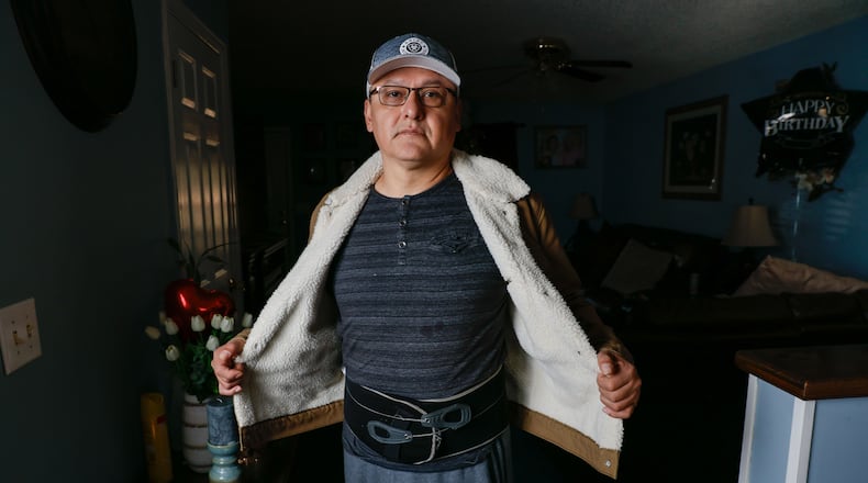 Jovito Caballero shows the back brace belt he wears all day to withstand back pain after an injury forced him to stop working. Caballero is currently involved in a legal dispute with Pilgrim’s Pride, the company he worked for over 20 years. Following a significant workplace injury, he was compelled to sign a document falsely disclaiming that the injury occurred on the job.
Miguel Martinez /miguel.martinezjimenez@ajc.com