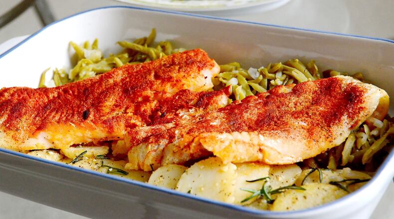 Serve paprika cod fillets with fried rosemary-topped potatoes and green beans cooked in chicken stock and minced shallots. (Lake Fong/Pittsburgh Post-Gazette/TNS)