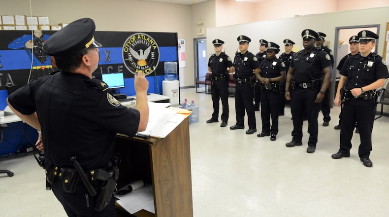 Atlanta Police Sgt A. Gruen conducts roll call briefing for APDofficers in the Zone 6, East Precinct, before they deploy in the area Tuesday, June 4, 2013. Crime is down statistically and there are more police officers on the street at anytime over the past two decades. Yet, many city residents still feel unsafe. And when crime visits, as it did in East Atlanta during a string of violent armed robberies -- one that ended in a murder -- citizens react by calling for more patrols, or even paying for their own.