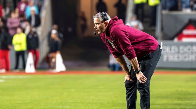 Florida State head coach Mike Norvell stands on the field during the second half of an NCAA college football game against North Carolina State, Friday, Nov. 21, 2025, in Raleigh, N.C. (AP Photo/David Yeazell)