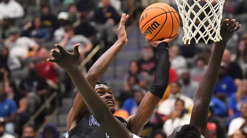 March 5, 2022 Buford - Newton's Qua Brown (1) shoots against Norcross' Jerry Deng (15) in the second half of 2022 GHSA Basketball Playoffs at Buford Arena on Saturday, March 5, 2022. Norcross won 75-72 over Newton. (Hyosub Shin / Hyosub.Shin@ajc.com)