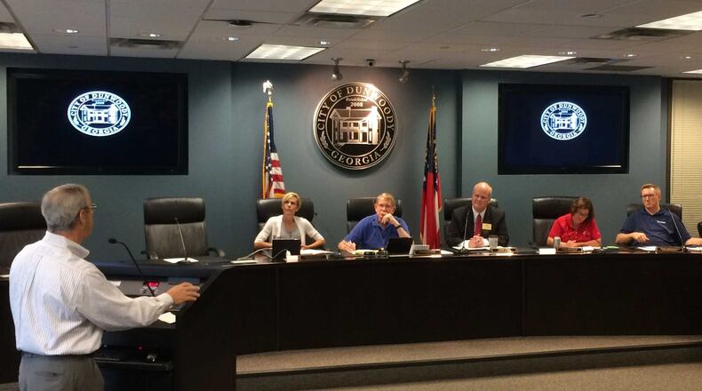 Seated are Councilwoman Pam Tallmadge, Mayor Denis Shortal, Councilman Terry Nall, Councilwoman Lynn Deutsch and Councilman John Heneghan. MARK NIESSE / MARK.NIESSE@AJC.COM