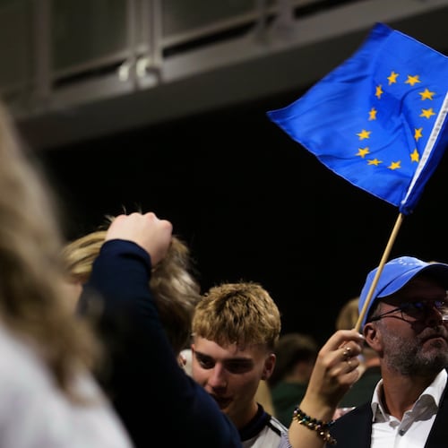 A supporter waves a European Union flag during an election-night gathering for the yes in Reykjavik, Iceland, Sunday, Aug. 30, 2026. (AP Photo/Marco Di Marco)