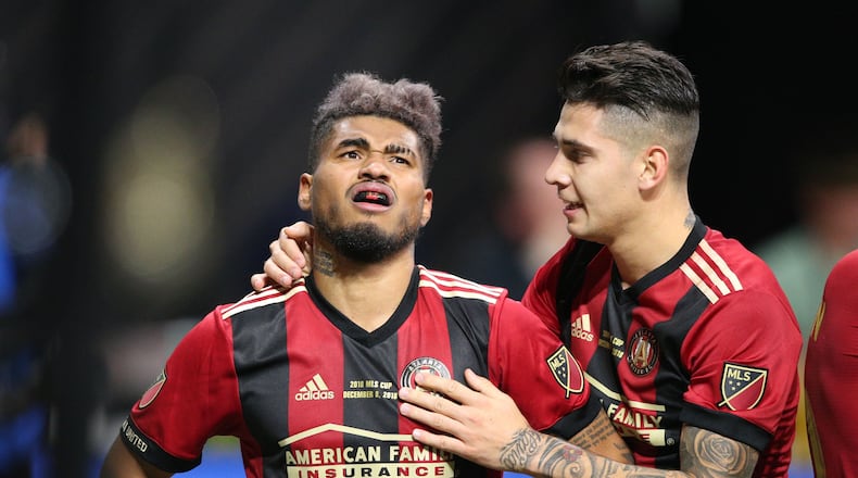 12/8/18 - Atlanta - Atlanta United defender Franco Escobar (2) congratulates Atlanta United forward Josef Martinez (7) after he scored a goal in the first half. The Atlanta United soccer team plays the Portland Timbers for the MLS Cup, the championship game of the Major League Soccer League at Mercedes-Benz Stadium in Atlanta. CURTIS COMPTON / CCOMPTON@AJC.COM