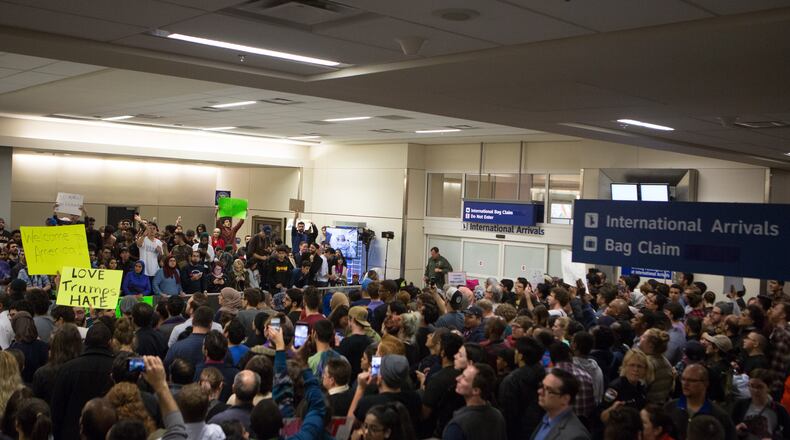 Protesters converged on airports across the county to demonstrate against President Donald Trump's executive order banning Muslims from seven nations from entering the United States for the next 90 days.
