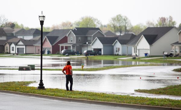 Flood waters cover the entryway to the Weather Stone subdivision off Russellville Road in Bowling Green, Ky., on Friday, April 4, 2025, after excessive rainfall Thursday into Friday drenched southcentral Kentucky with more than four and a half inches of rain. (Grace McDowell /Daily News via AP)