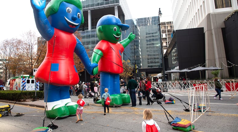 Children play around Large blowups of Hope and Will during the Children’s Healthcare of Atlanta Holiday Experience Saturday, December 4, 2021, one of the system's fundraising events. With $6.2 billion in unrestricted cash and investments, the nonprofit hospital system is now one of nation’s the richest pediatric health centers. (Steve Schaefer for The Atlanta Journal-Constitution)