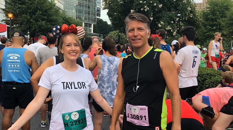 Taylor Scott and Kevin Avery, syndicated morning hosts at 104.7/The Fish, have run the AJC Peachtree Road Race many times. This is a shot from 2019. Courtesy