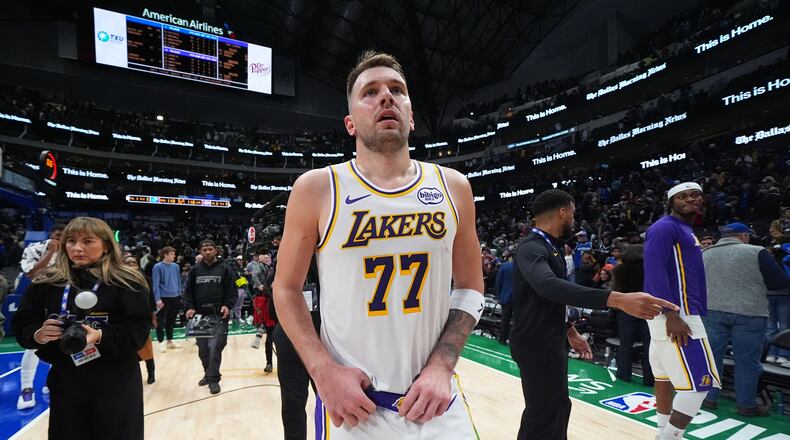 Los Angeles Lakers guard Luka Doncic looks on following an NBA basketball game against the Dallas Mavericks Saturday, Jan. 24, 2026, in Dallas. (AP Photo/Julio Cortez)