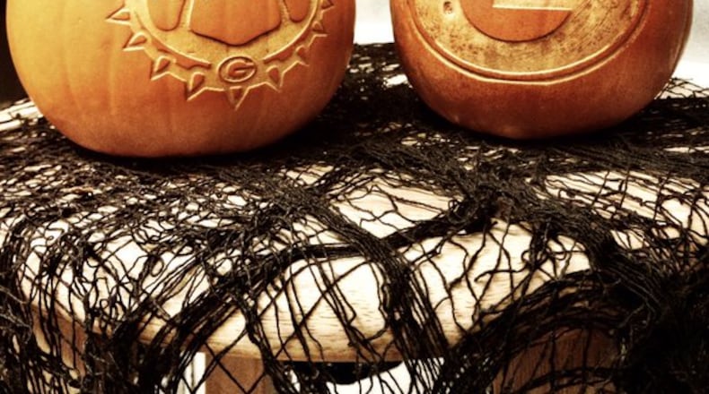 The MakerSpace lab at the University of Georgia's science library carved these Dawg-themed pumpkins ahead of Halloween this year. Photo by @UGAAthletics on Twitter.