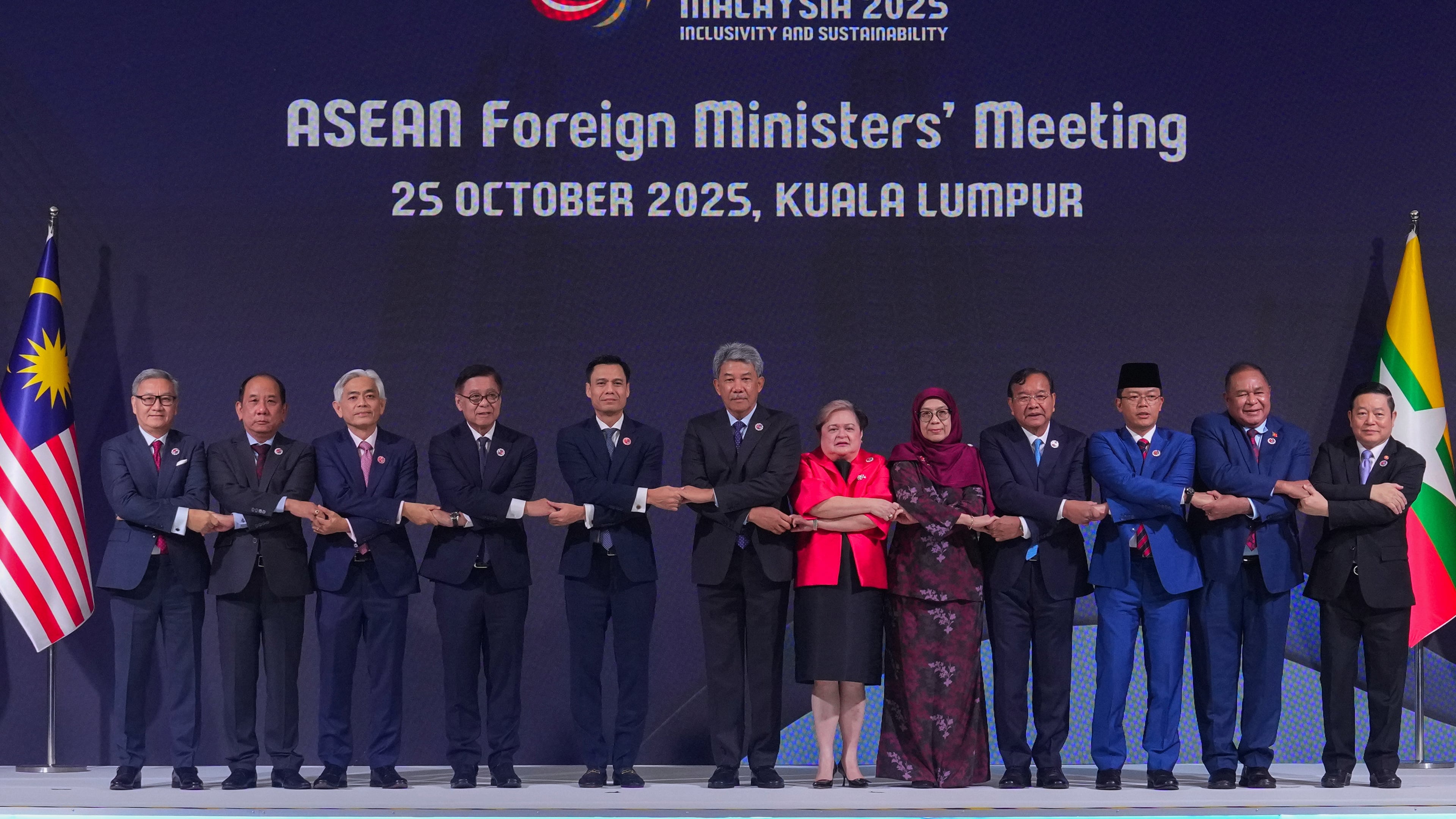 From left to right, Lao's Minister of Foreign Affairs Thongsavanh Phomvihane, Myanmar's Permanent Secretary of the Ministry of Foreign Affairs U Hau Khan Sum, Singapore's Permanent Secretary of Foreign Affairs Albert Chu, Thailand's Foreign Minister Sihasak Phuangketkeow, Vietnam's Deputy Minister of Foreign Affairs Dang Hoang Giang, Malaysia's Foreign Minister Mohamad Hasan, Philippine Foreign Secretary Theresa Lazaro, unidentified Brunei's representative, Cambodia's Foreign Minister Prak Sokhonn, Indonesia's Foreign Minister Sugiono, East Timor's Foreign Minister Bendito dos Santos Freitas and ASEAN Secretary-General Kao Kim Hourn pose for a group photo during ASEAN foreign ministers' meeting at the Kuala Lumpur Convention Centre in Kuala Lumpur, Malaysia, Saturday, Oct. 25, 2025. (AP Photo/Rafiq Maqbool)