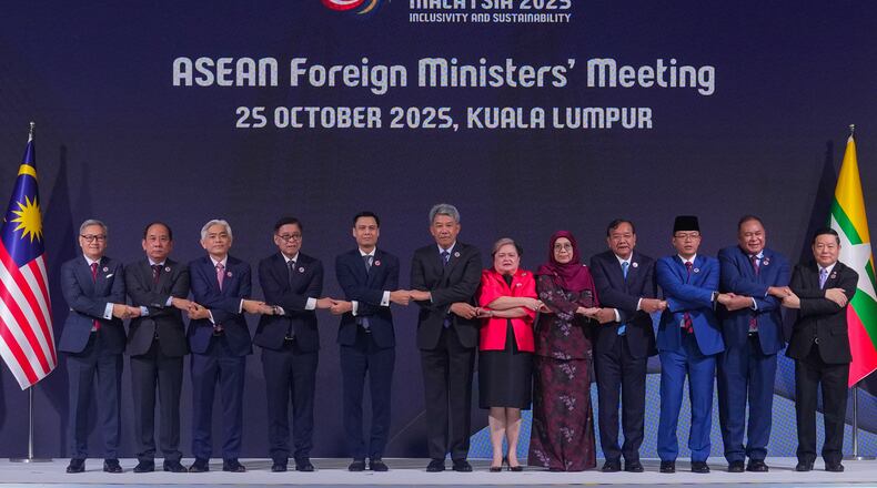From left to right, Lao's Minister of Foreign Affairs Thongsavanh Phomvihane, Myanmar's Permanent Secretary of the Ministry of Foreign Affairs U Hau Khan Sum, Singapore's Permanent Secretary of Foreign Affairs Albert Chu, Thailand's Foreign Minister Sihasak Phuangketkeow, Vietnam's Deputy Minister of Foreign Affairs Dang Hoang Giang, Malaysia's Foreign Minister Mohamad Hasan, Philippine Foreign Secretary Theresa Lazaro, unidentified Brunei's representative, Cambodia's Foreign Minister Prak Sokhonn, Indonesia's Foreign Minister Sugiono, East Timor's Foreign Minister Bendito dos Santos Freitas and ASEAN Secretary-General Kao Kim Hourn pose for a group photo during ASEAN foreign ministers' meeting at the Kuala Lumpur Convention Centre in Kuala Lumpur, Malaysia, Saturday, Oct. 25, 2025. (AP Photo/Rafiq Maqbool)