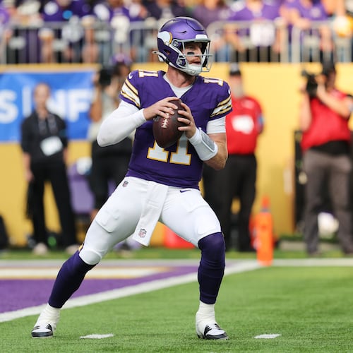 Minnesota Vikings quarterback Carson Wentz (11) drops back to pass during the first half of an NFL football game against the Green Bay Packers, Sunday, Sept. 13, 2026, in Minneapolis, Minn. (AP Photo/Bailey Hillesheim)