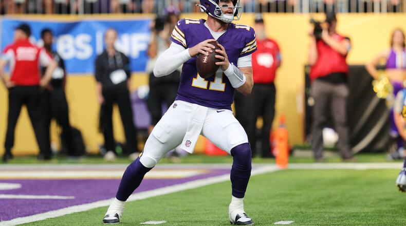 Minnesota Vikings quarterback Carson Wentz (11) drops back to pass during the first half of an NFL football game against the Green Bay Packers, Sunday, Sept. 13, 2026, in Minneapolis, Minn. (AP Photo/Bailey Hillesheim)