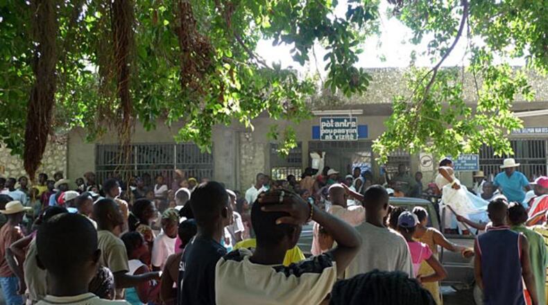 crowds arrive at the hospital in Deschapelles.