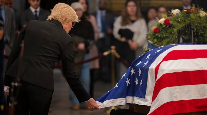Becky Carter, daughter-in-law of former President Jimmy Carter, walks around the former President’s casket as he lies in state inside the rotunda of the U.S. Capitol Building in Washington, DC on Wednesday, January 8, 2025.