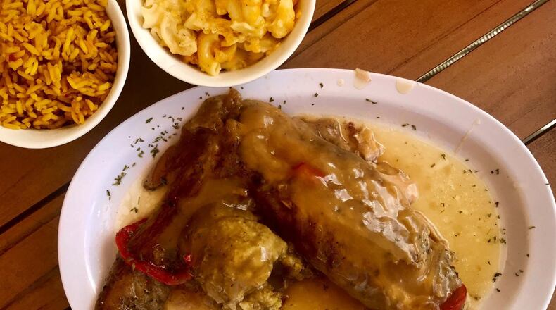 The Juicy Smoked Turkey at Lickety Split in Hapeville is as juicy as the name promises. Smothered in turkey gravy and served with a scoop of a dressing, the plate is like a precursor to Thanksgiving. Yellow rice and mac and cheese (pictured at rear) are among numerous side dishes available at the Southern restaurant. LIGAYA FIGUERAS/LFIGUERAS@AJC.COM