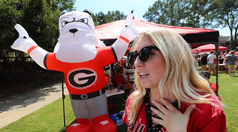 Emma Moore, 22, Dacula, says she opposes campus carry while tailgating at Myers Quad before Georgia plays Appalachian State on Saturday, September 2, 2017, in Athens. Curtis Compton/ccompton@ajc.com