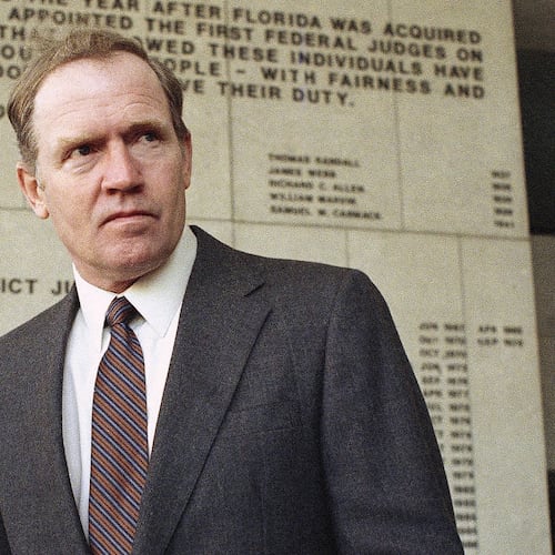 FILE - Eugene Hasenfus stands outside U.S. District Court in Miami, Tuesday, Dec. 13, 1986 after appearing at a status hearing in his lawsuit against two Iran-Contra figures. (AP Photo/Kathy Willens, File)