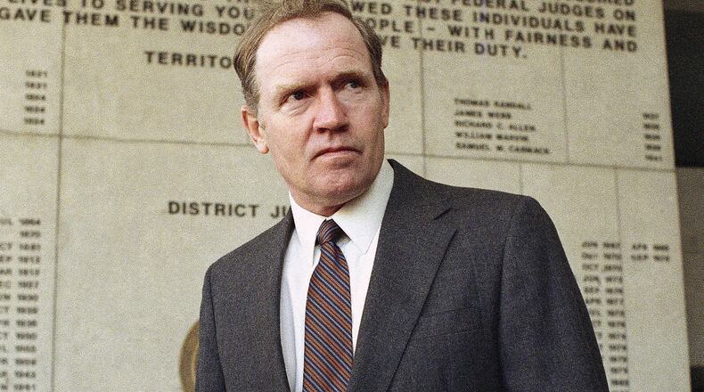 FILE - Eugene Hasenfus stands outside U.S. District Court in Miami, Tuesday, Dec. 13, 1986 after appearing at a status hearing in his lawsuit against two Iran-Contra figures. (AP Photo/Kathy Willens, File)
