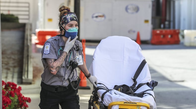 Grady Advanced EMT, Emma Hovis prepares for another patient call. First responders at Grady Hospital are on the frontline of the COVID-19 epidemic and are taking precautions on each call. JOHN SPINK/JSPINK@AJC.COM