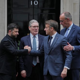 Ukrainian President Volodymyr Zelenskyy, left, with Britain's Prime Minister Keir Starmer, French President Emmanuel Macron, and German Chancellor Friedrich Merz pose on the doorstep of 10 Downing Street, London, Monday, Dec. 8, 2025, following a meeting of the leaders inside. (AP Photo/Kin Cheung)