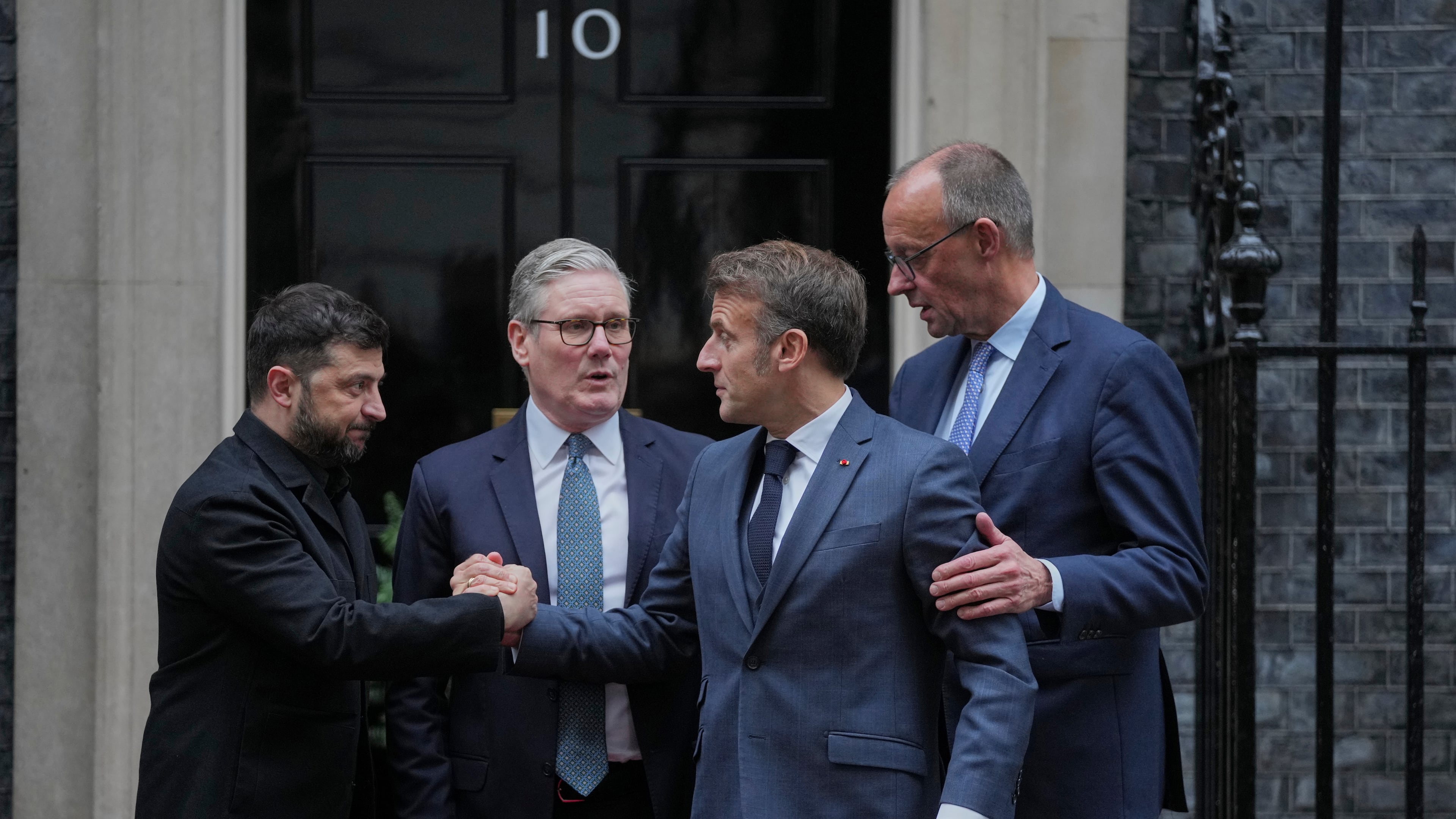 Ukrainian President Volodymyr Zelenskyy, left, with Britain's Prime Minister Keir Starmer, French President Emmanuel Macron, and German Chancellor Friedrich Merz pose on the doorstep of 10 Downing Street, London, Monday, Dec. 8, 2025, following a meeting of the leaders inside. (AP Photo/Kin Cheung)