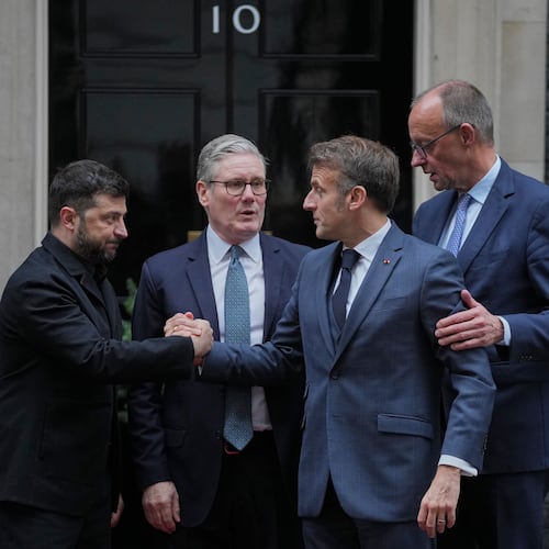 Ukrainian President Volodymyr Zelenskyy, left, with Britain's Prime Minister Keir Starmer, French President Emmanuel Macron, and German Chancellor Friedrich Merz pose on the doorstep of 10 Downing Street, London, Monday, Dec. 8, 2025, following a meeting of the leaders inside. (AP Photo/Kin Cheung)