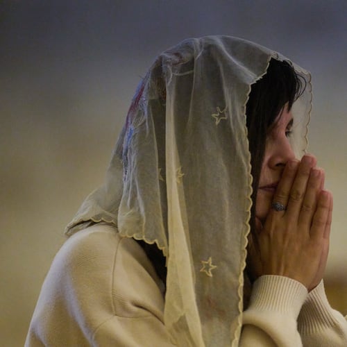 A Christian pilgrim attends a Mass in the Basilica of the Transfiguration on Mount Tabor, northern Israel, Aug. 6, 2026. (AP Photo/Ariel Schalit)
