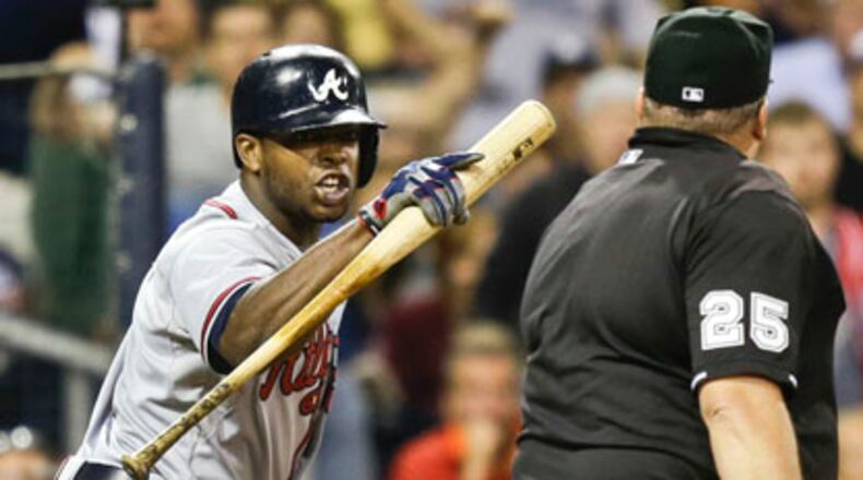 Atlanta Braves' Justin Upton rants against home plate umpire Fieldin Culbreth after being called out on strikes to end the eighth inning against the San Diego Padres in a baseball game in San Diego, Tuesday, June 11, 2013. (AP Photo/Lenny Ignelzi)