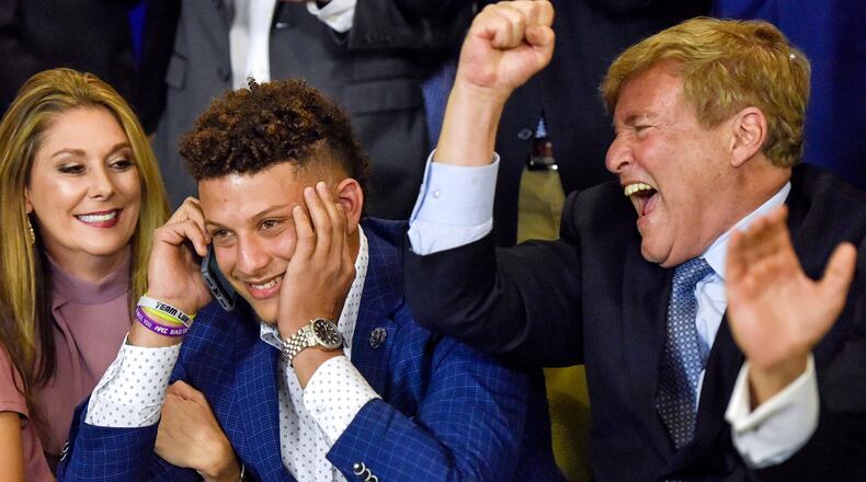 Patrick Mahomes, center, reacts with Randi Martin, left, and agent Leigh Steinberg after the Chiefs made a bold move to select the Texas Tech quarterback with the 10th overall pick of the draft. CREDIT: Chelsea Purgahn/Tyler Morning Telegraph