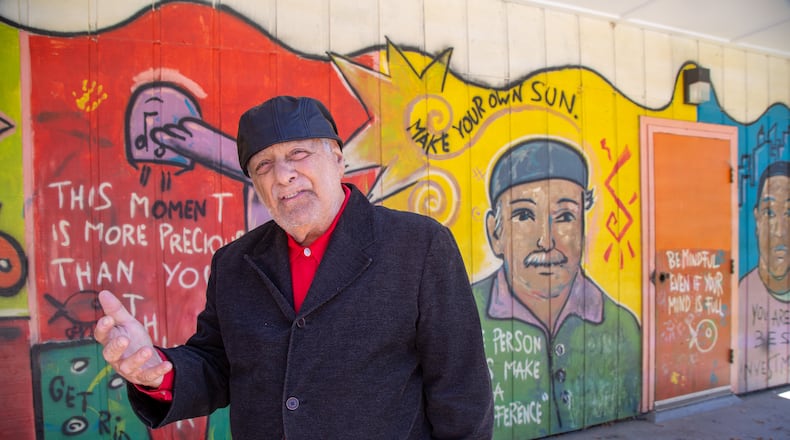 Rick McDevitt describes the meaning behind the murals, one behind him that has his likeness, at The Rick McDevitt Youth Center. Thirty years ago McDevitt says he discovered an old building in Peoplestown near downtown Atlanta that was scheduled to be demolished and he saw a need for a teen center. He got funding from then Home Depot CEO Arthur Blank and others to remodel the building. Since then he has been helping children at youth center that bears his name. PHIL SKINNER FOR THE ATLANTA JOURNAL-CONSTITUTION.