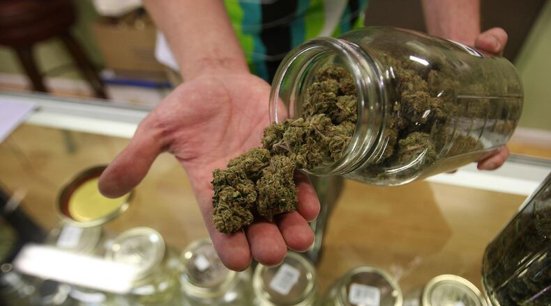 LOS ANGELES, CA - OCTOBER 19:  Dave Warden, a bud tender at Private Organic Therapy (P.O.T.), a non-profit co-operative medical marijuana dispensary, displays various types of marijuana available to patients on October 19, 2009 in Los Angeles, California. Attorney General Eric Holder announced new guidelines today for federal prosecutors in states where the use of marijuana for medicinal purposes is allowed under state law. Federal prosecutors will no longer trump the state with raids on the southern California dispensaries as they had been doing, but Los Angeles County District Attorney Steve Cooley recently began a crackdown campaign that will include raids against the facilities. Cooley maintains that virtually all marijuana dispensaries are in violation of the law because they profit from their product. The city of LA has been slow to come to agreement on how to regulate its 800 to 1,000 dispensaries. Californians voted to allow sick people with referrals from doctors to consume cannabis with the passage of state ballot Proposition 215 in 1996 and a total of 14 states now allow the medicinal use of marijuana. (Photo by David McNew/Getty Images)
