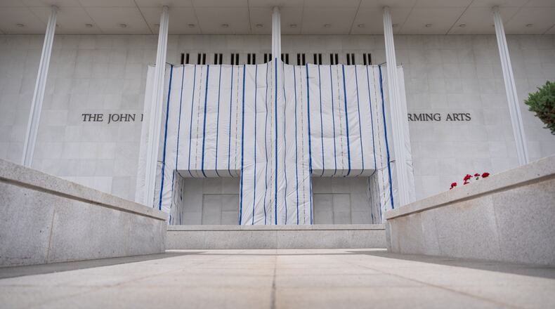 The John F. Kennedy Center for the Performing Arts is seen, as its sign remains covered by a tarp, Friday, June 19, 2026, in Washington. (AP Photo/Mark Schiefelbein)