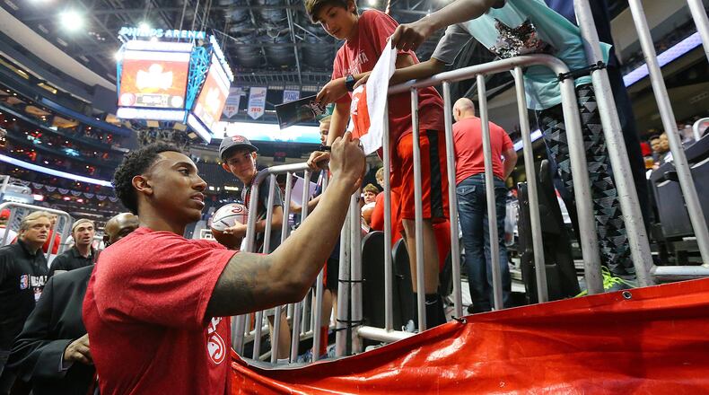 Hawks guard Jeff Teague signs autographs for fans before the first-round playoff game against the Nets at Philips Arena on Wednesday, April 22, 2015. Curtis Compton / ccompton@ajc.com