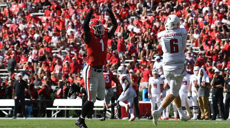 Georgia defeated Austin Peay 45-0 in the 2018 season opening game at Sanford Stadium. Here Georgia linebacker Brenton Cox applies pressure to Governors quarterback Jeremiah Oatsvall. (Perry McIntyre)