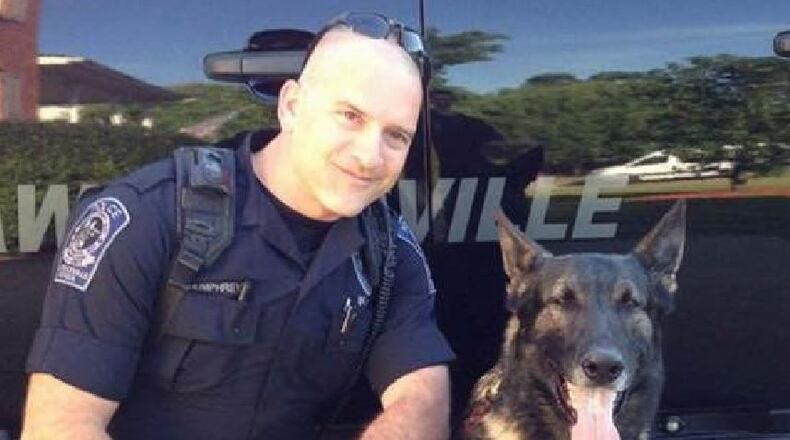 Lawrenceville police K9 Eiko, seen here with handler Officer Shawn Humphreys, passed away Thursday after being diagnosed with cancer. (Courtesy of Lawrenceville Police Department)