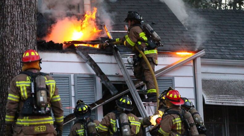 A Buckhead house being rented by four college friends from Auburn University went up in flames Friday morning before dawn.