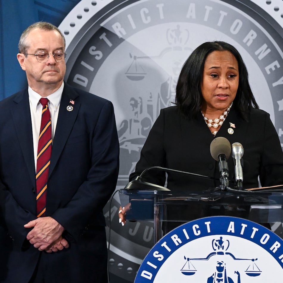 Fulton DA Fani Willis (center) with Nathan J. Wade (right), the special prosecutor she hired to manage the Trump case and had a romantic relationship with, at a news conference announcing charges against President-elect Donald Trump and others in Atlanta, Aug. 14, 2023. Georgia’s Supreme Court on Tuesday, Sept. 16, 2025, upheld an appeals court's decision to disqualify Willis from the election interference case against Trump and his allies. (Kenny Holston/New York Times)