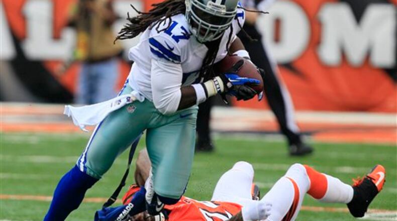 Dallas Cowboys wide receiver Dwayne Harris (17) runs past Cincinnati Bengals cornerback Adam Jones (24) after catching a pass in the first half of an NFL football game, Sunday, Dec. 9, 2012, in Cincinnati. (AP Photo/Al Behrman) Dallas Cowboys wide receiver Dwayne Harris (17) runs past Cincinnati Bengals cornerback Adam Jones (24) after catching a pass in the first half of an NFL football game, Sunday, Dec. 9, 2012, in Cincinnati. (AP Photo/Al Behrman)