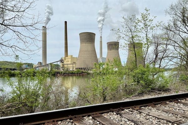 American Electric Power's John Amos coal-fired plant in Winfield, W.Va, is seen from the town of Poca across the Kanawha River, Tuesday, April 22, 2025. (AP Photo/John Raby)