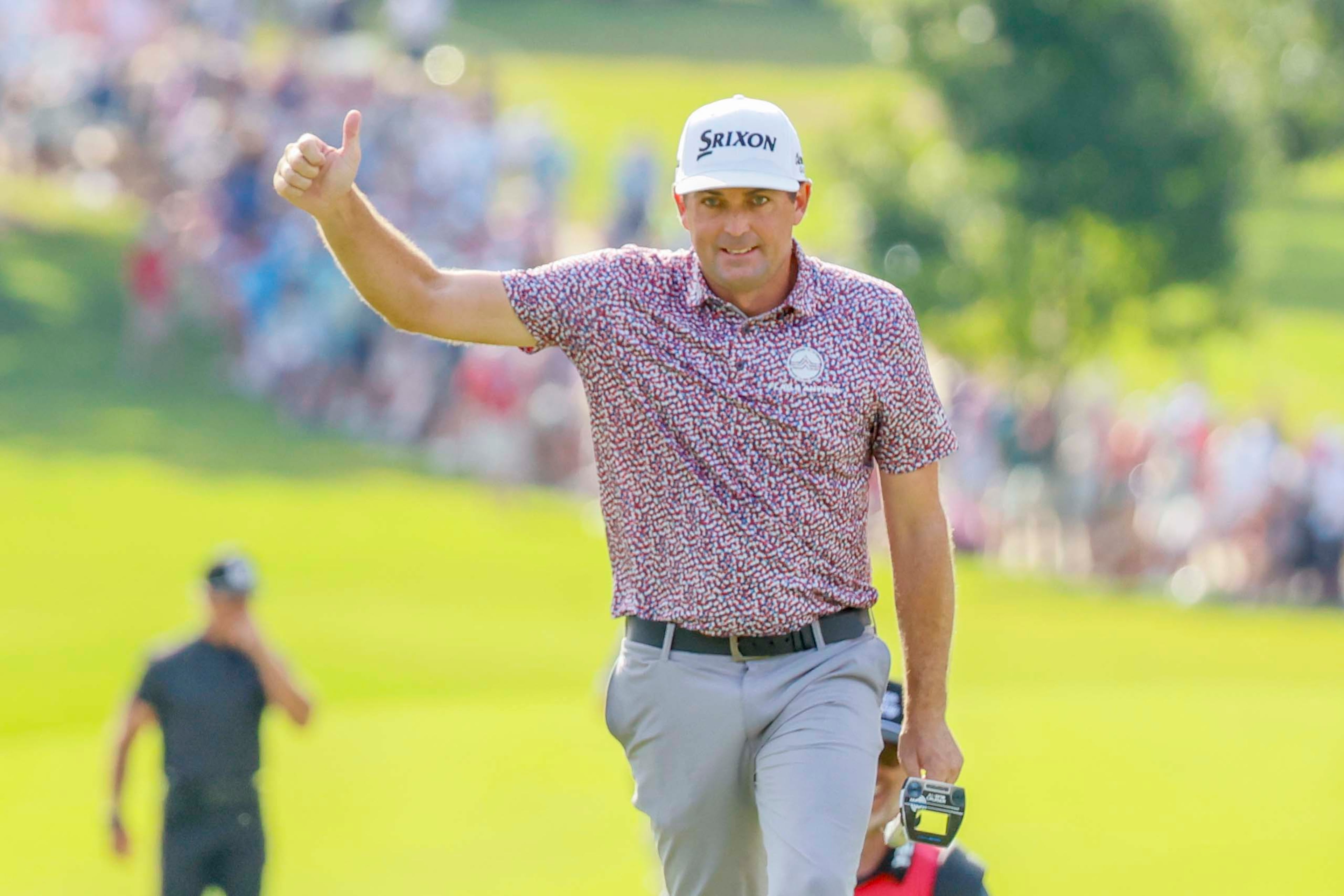 Keegan Bradley signals to fans after being recognized as he approaches the 18th hole during the final round of the PGA Tour Championship at East Lake Golf Club, on Sunday, Aug. 24, 2025, in Atlanta. (Miguel Martinez/ AJC)