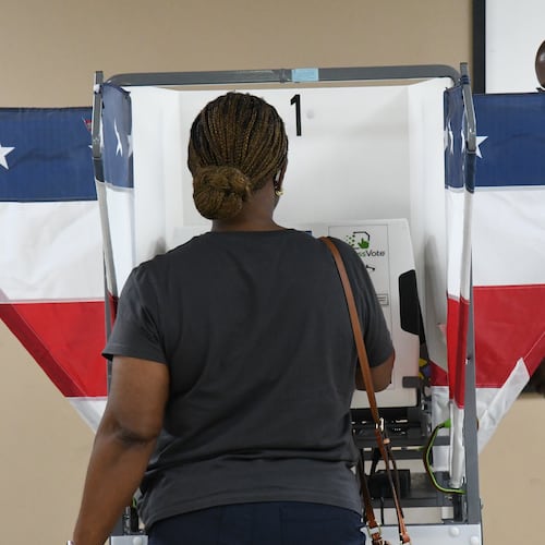 Two voters fill out their ballots in Memphis, Tenn., Wednesday, July 22, 2026. (AP Photo/Kristin M. Hall)